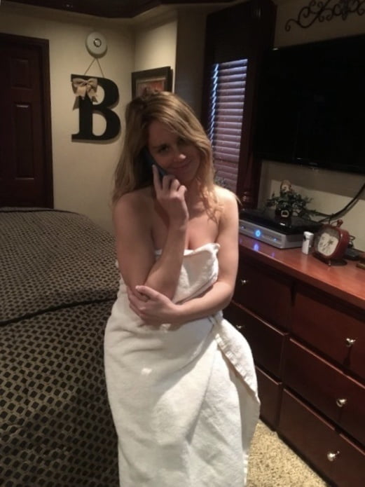 Blonde MILF with huge tits taking Selfies