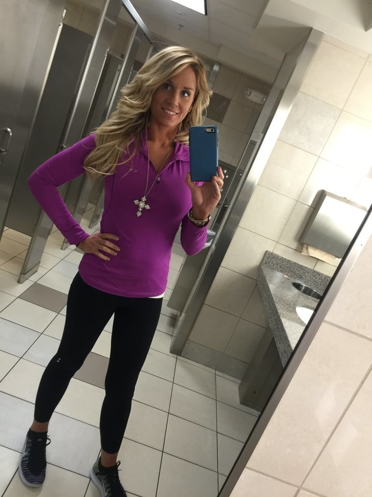 Blonde MILF with huge tits taking Selfies