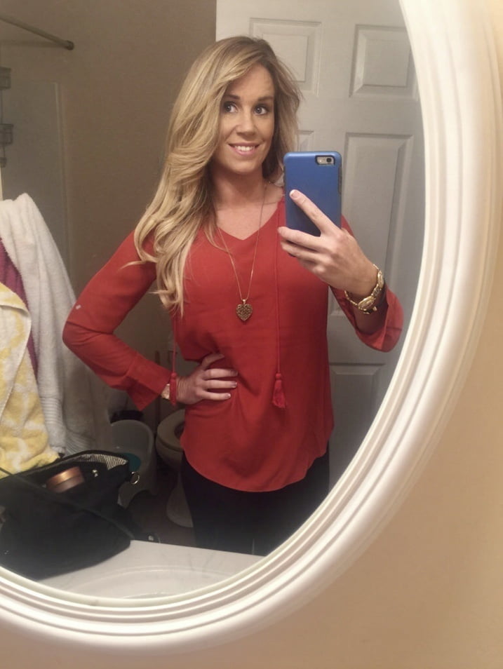 Blonde MILF with huge tits taking Selfies