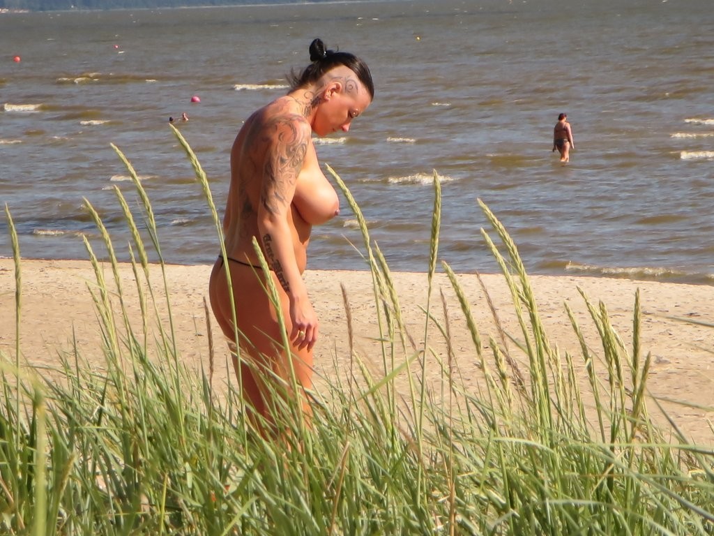 Mature Tattoo Milf on Beach