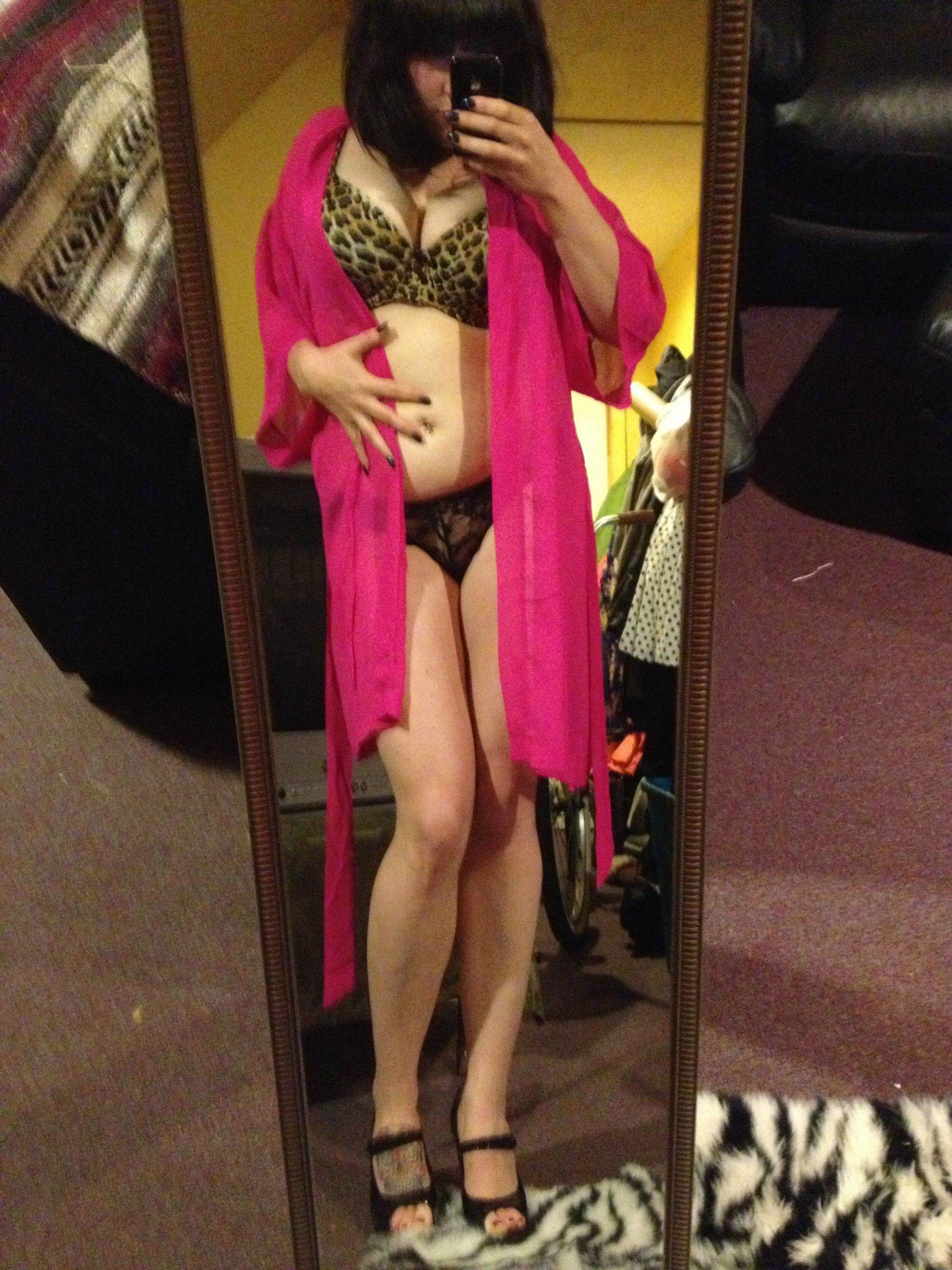 Curvy Brunette In Red Llipstick And Stockings