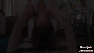 Brunette babe rubs pussy before tugging and giving footjob