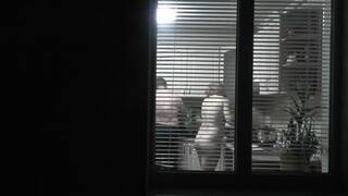 Family nudism . Naked stepdaughter cooking dinner walks naked in front of Dad at open window public