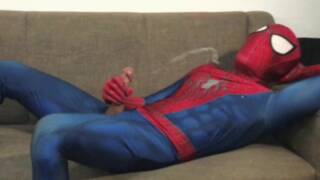 Horny Spiderman jerks off and cums massive load