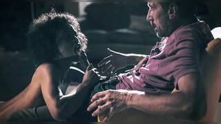 Photographer makes an ebony model squirt