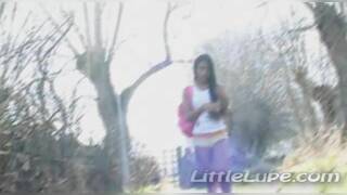 Petite latina masturbates under the sun