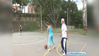 Paris Milan plays basketball outdoors