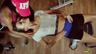 Alexa T and Verona S inside a gym in a lesbian workout scene together