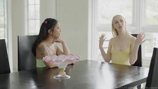 Braylin Bailey and Ameana Green on a white coloured bed in a lesbian scene together