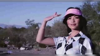 Scarlett Alexis and Amber Moore on green chair next to fireplace lesbian Strap-on