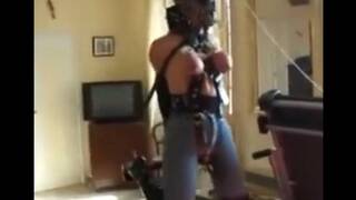 Angela dangles from the ceiling and whipped