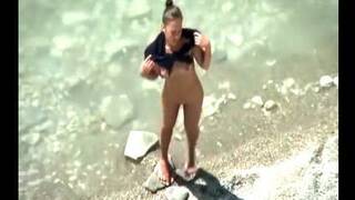 stepmother wades naked in the surf