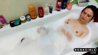 Beautiful babe plays with her body under the water.