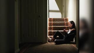 Whitney Wright and Casey Calvert on a blue coloured bed in several lesbian scenes