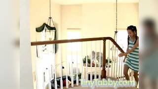 Petite teen spreads her skinny legs