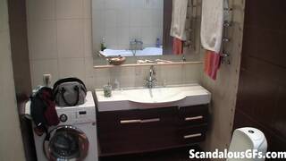 Rebecca rainbow cleansing her skin after shower