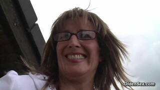 German mature lady Klaudia in nylons plays with her shaved pussy