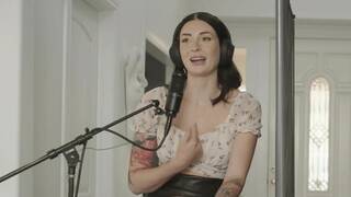 Queenie Sateen and Charlotte Sins on a white coloured bed in several lesbian scenes