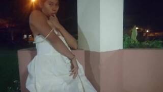 Tiny-titted Asian babe plays with herself outdoors