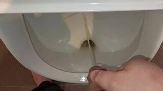 Man peeing in urinal